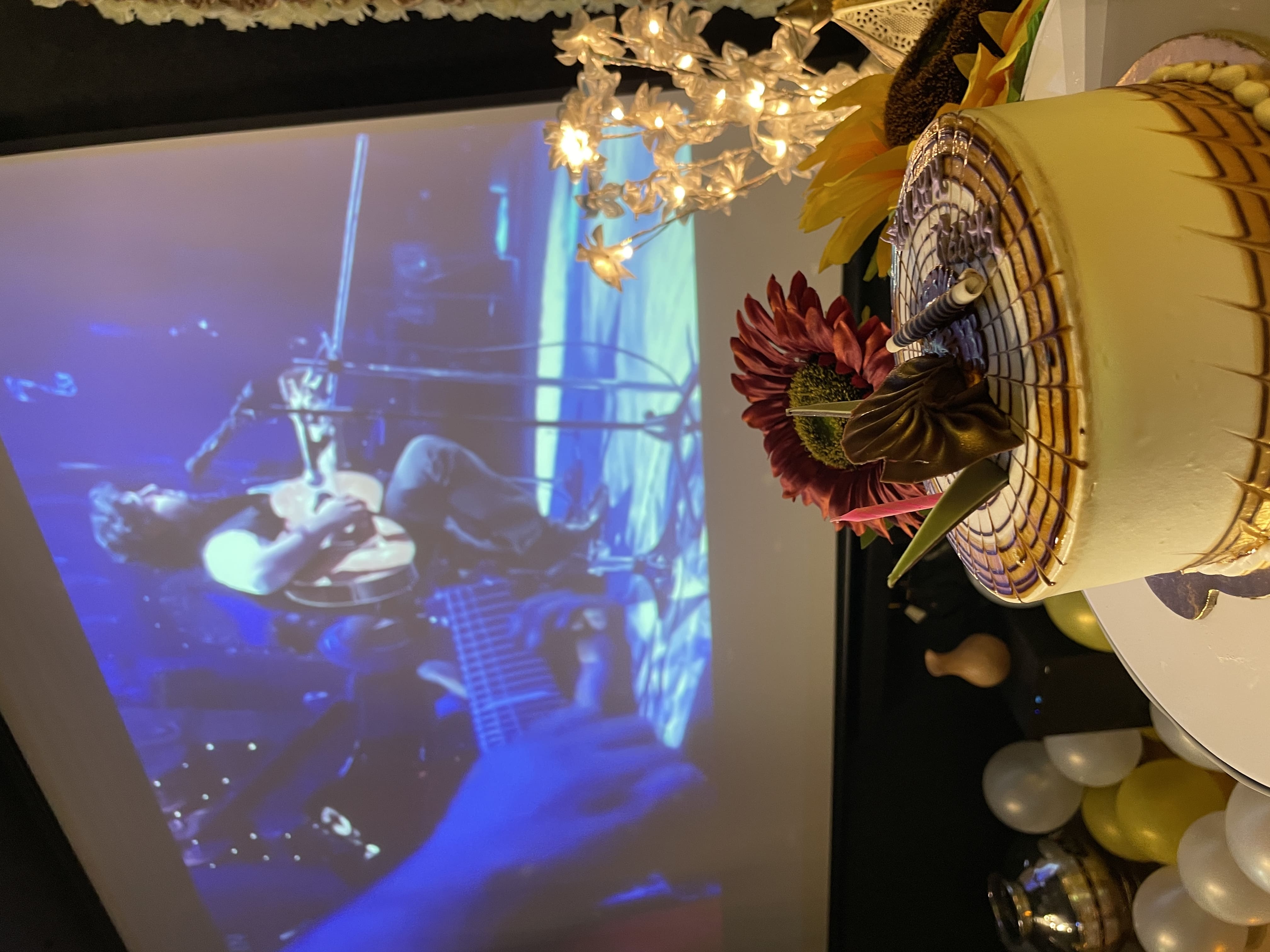 Two people sitting in a theater with 3D glasses and popcorn